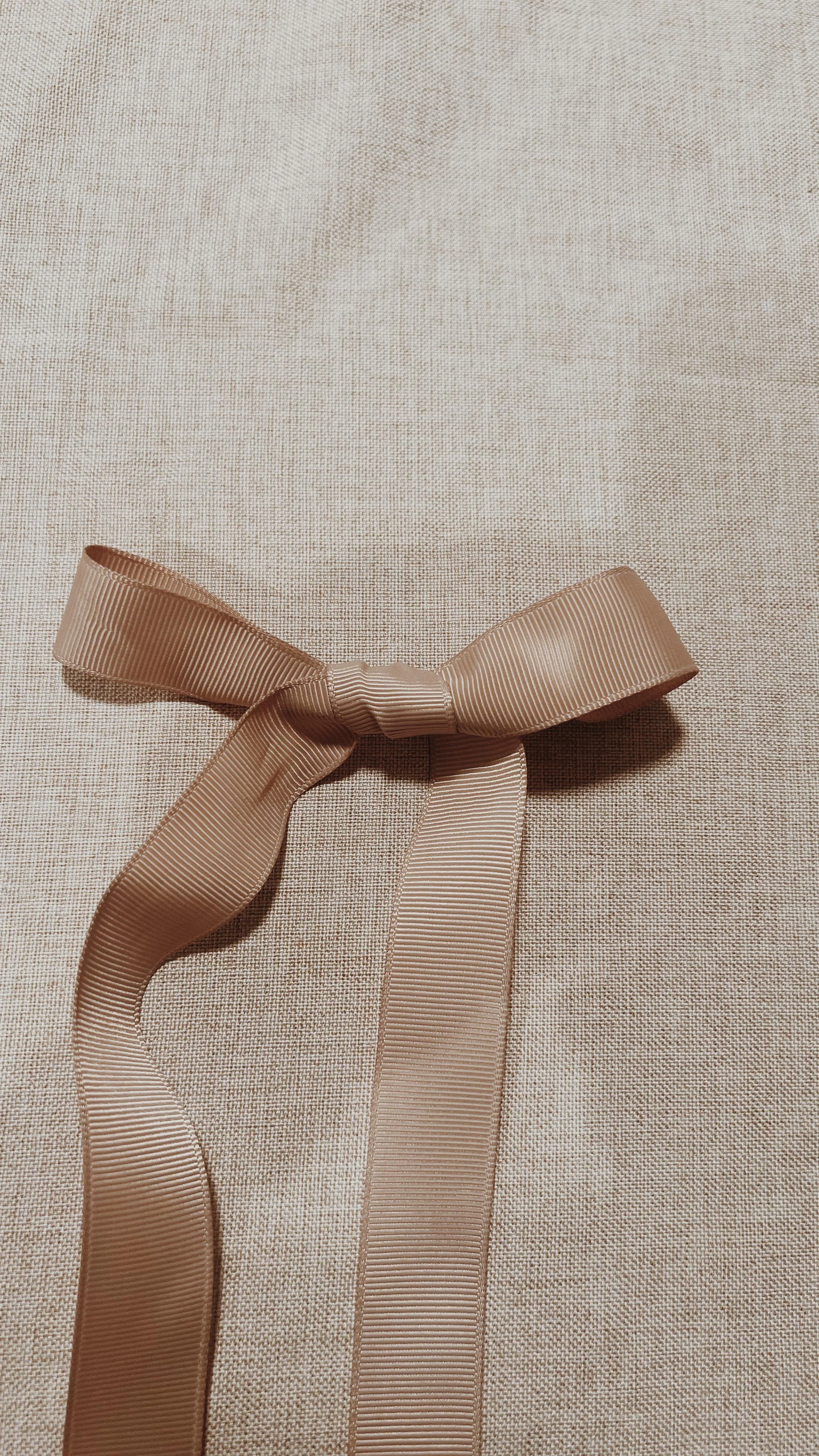 Wrynne grosgrain ribbon tied by hand