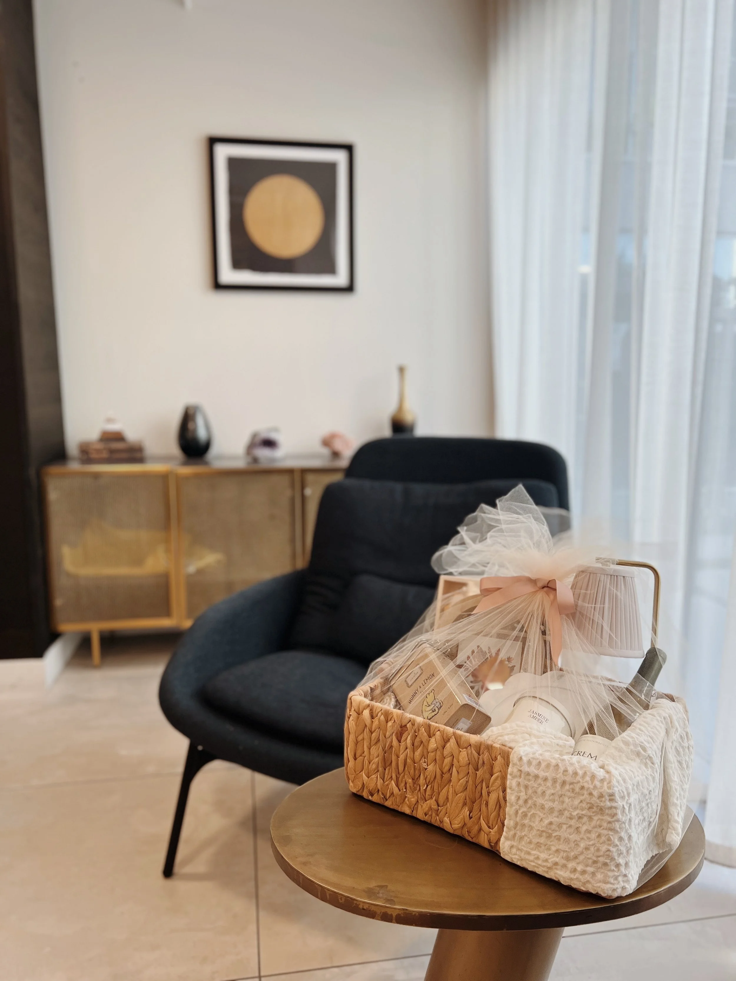 A generous Wrynne gift basket, finished with ribbon